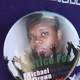 A button featuring a picture of Michael Brown is worn by a resident during a press conference with Ferguson, Mo., Police Chief Thomas Jackson Aug. 13, 2014.
Scott Olson/Getty Images